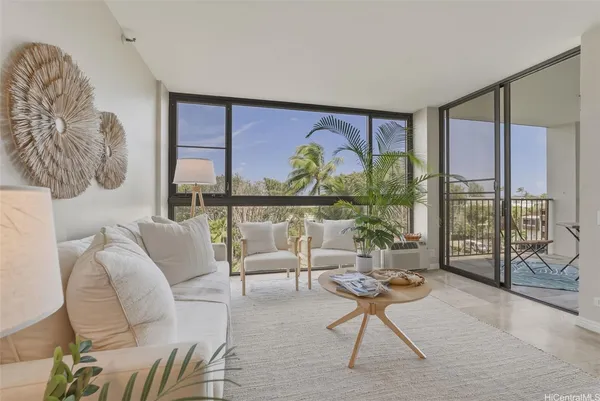 a living room with furniture and a large window
