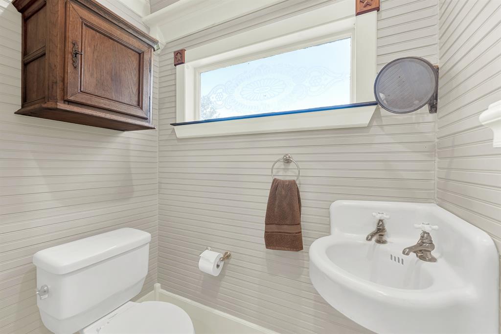 1425 Lone Star Road Celina, TX 75009 - Photo 12 of 40 Conveniently located for guests, this charming powder bath complements the home's historic character with classic fixtures, vintage-inspired details, and abundant natural light, offering both style and functionality.