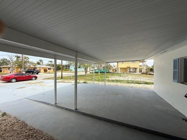 162 Tropical Shore Way Fort Myers Beach, FL 33931 - Photo 11 of 32 a view of car parked in garage