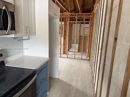 a view of a storage and utility room with washer and dryer