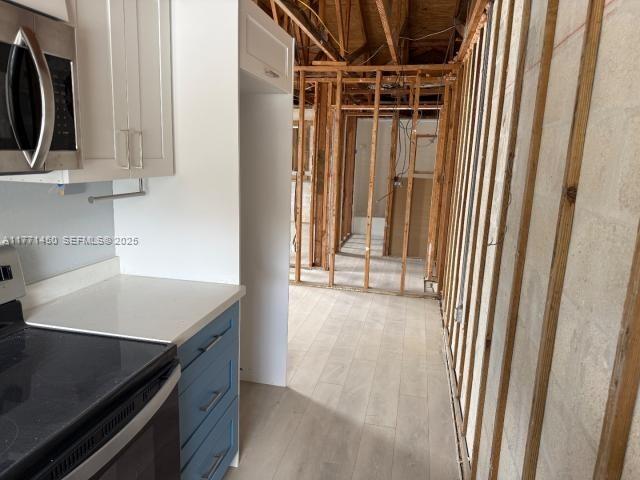 162 Tropical Shore Way Fort Myers Beach, FL 33931 - Photo 13 of 32 a view of a storage and utility room with washer and dryer