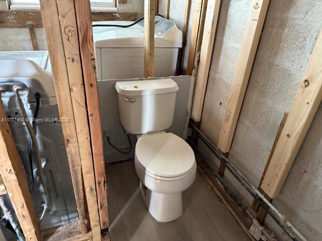 162 Tropical Shore Way Fort Myers Beach, FL 33931 - Photo 15 of 32 a white toilet sitting next to a bathroom sink