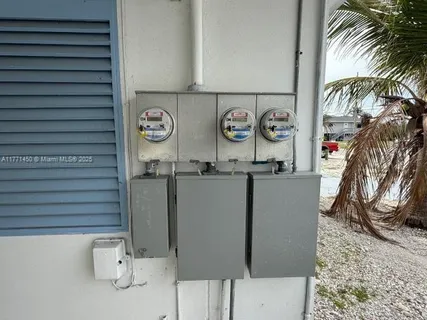 a kitchen with a sink a toilet and a rug