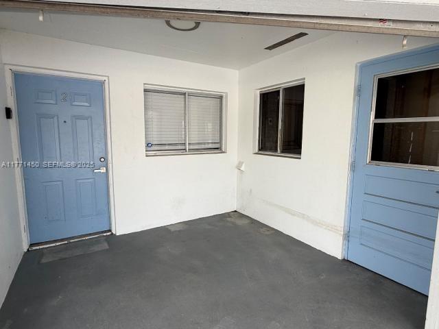 162 Tropical Shore Way Fort Myers Beach, FL 33931 - Photo 3 of 32 a view of an empty room with closet and wooden floor