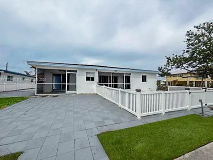 a view of a swimming pool with a deck