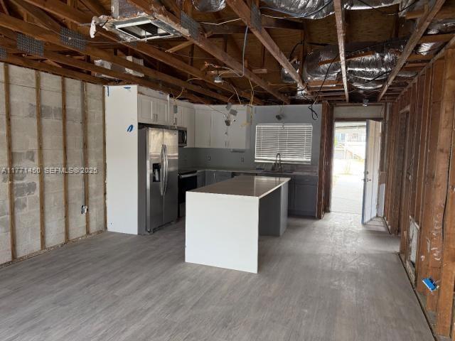 162 Tropical Shore Way Fort Myers Beach, FL 33931 - Photo 5 of 32 a kitchen that has a sink a refrigerator and window