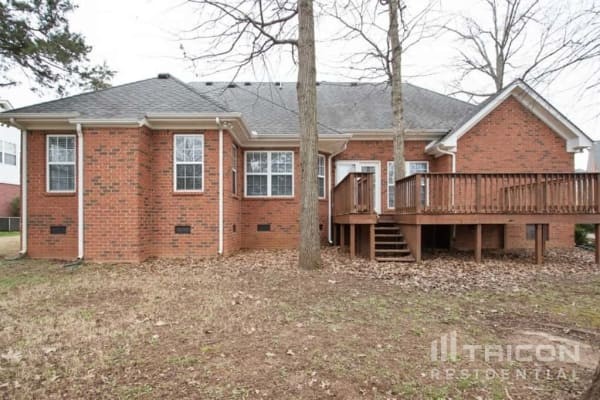 2911 Wolves Trail Murfreesboro, TN 37127 - Photo 15 of 15 a view of a house with wooden fence and a large tree