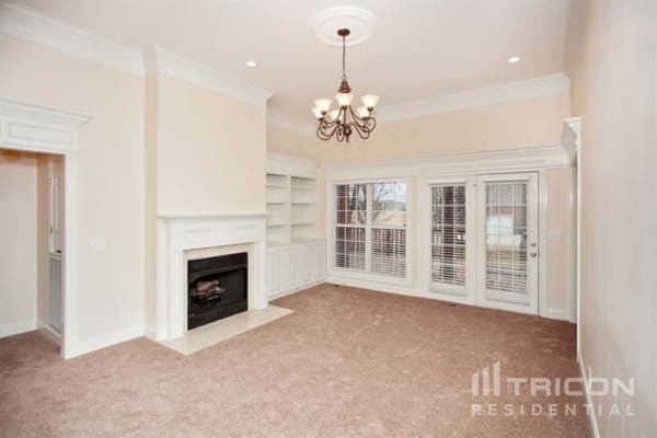 2911 Wolves Trail Murfreesboro, TN 37127 - Photo 5 of 15 a view of an empty room with a fireplace and windows