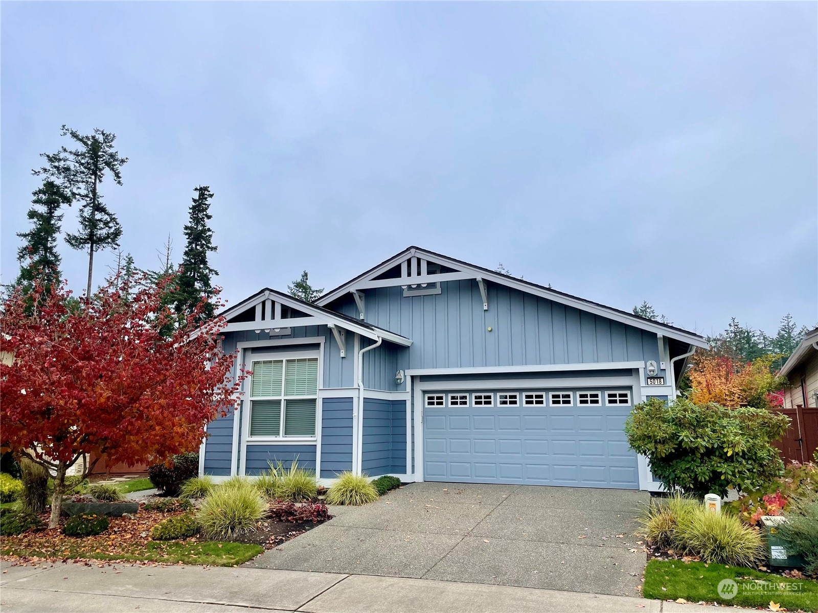 5018 Cypress Loop Northeast Lacey, WA 98516 - Photo 1 of 30 a front view of a house with a garden