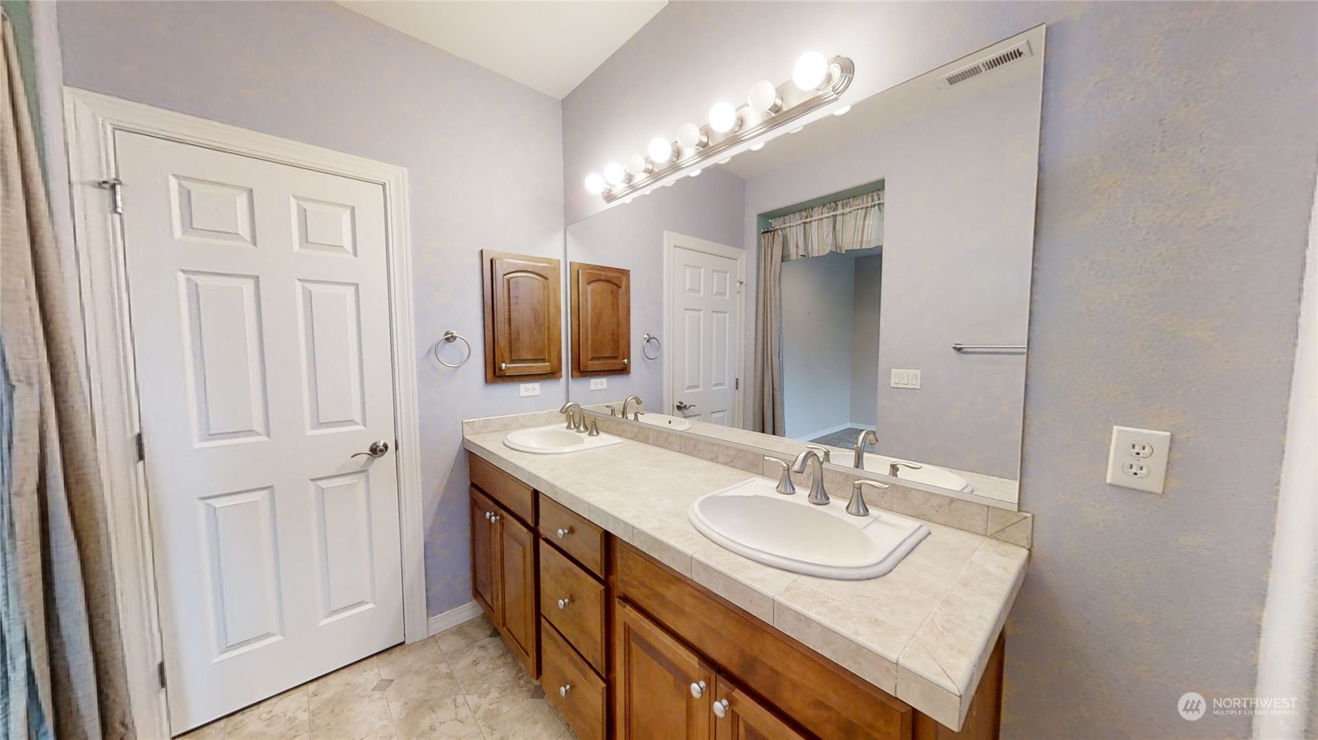5018 Cypress Loop Northeast Lacey, WA 98516 - Photo 12 of 30 a bathroom with a sink double vanity and a mirror