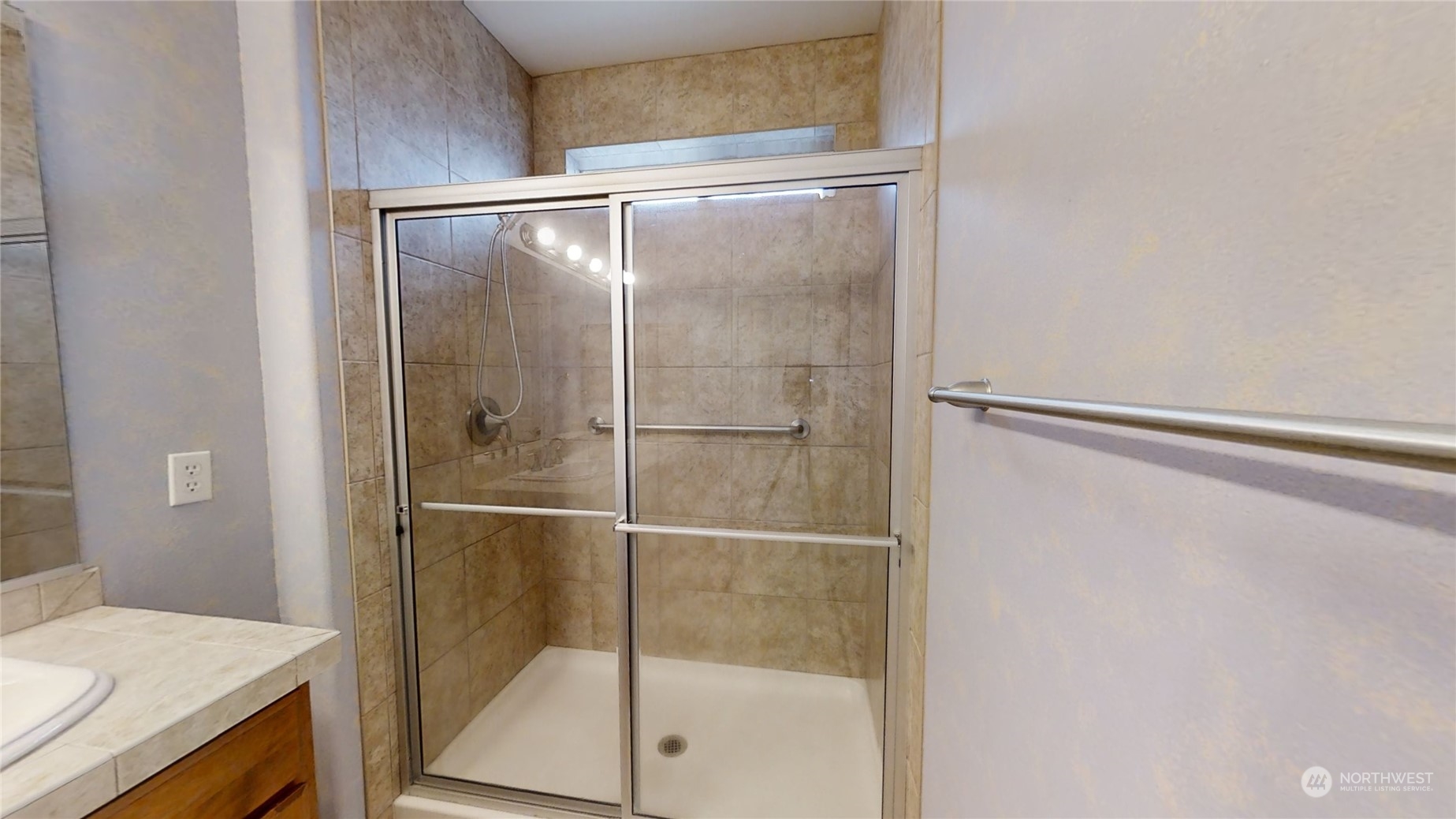 5018 Cypress Loop Northeast Lacey, WA 98516 - Photo 13 of 30 a bathroom with a glass shower door