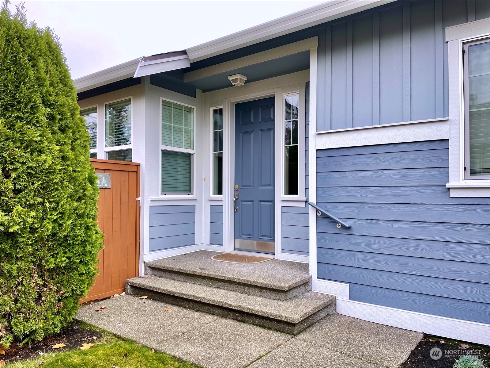 5018 Cypress Loop Northeast Lacey, WA 98516 - Photo 2 of 30 a front view of a house with a garden