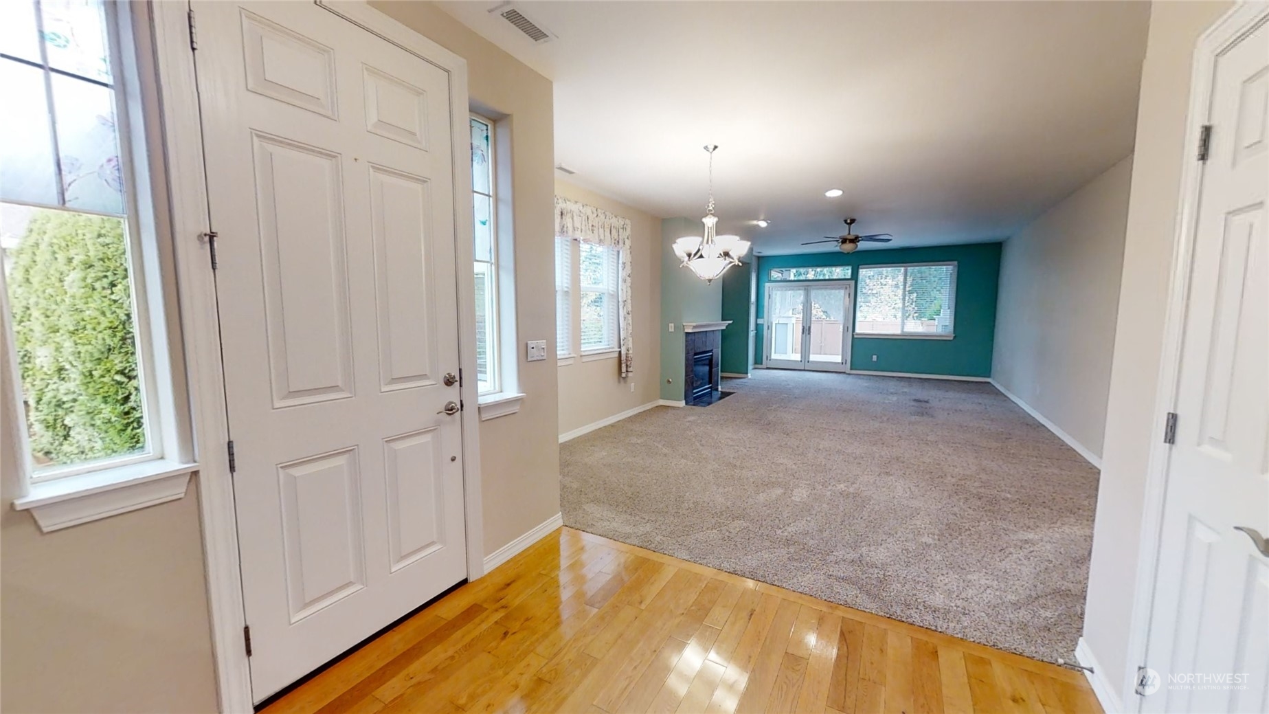 5018 Cypress Loop Northeast Lacey, WA 98516 - Photo 3 of 30 a view of a big room with windows and chandelier