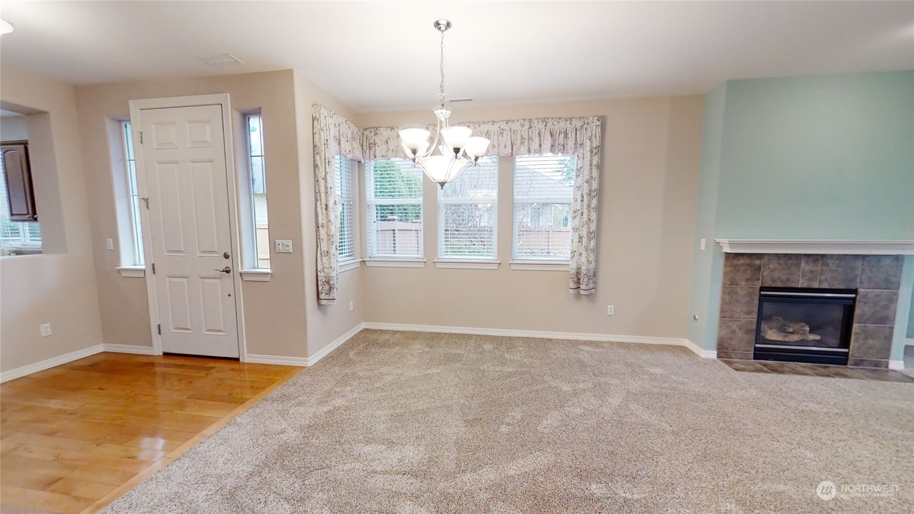 5018 Cypress Loop Northeast Lacey, WA 98516 - Photo 5 of 30 an empty room with windows and fireplace