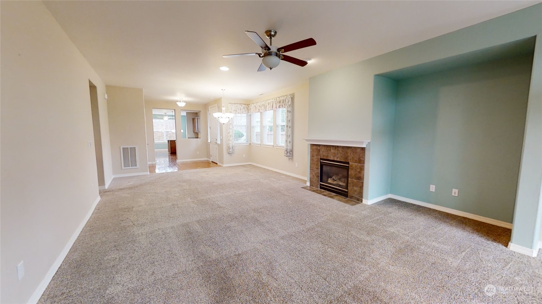 5018 Cypress Loop Northeast Lacey, WA 98516 - Photo 6 of 30 a view of a livingroom with a fireplace and a ceiling fan