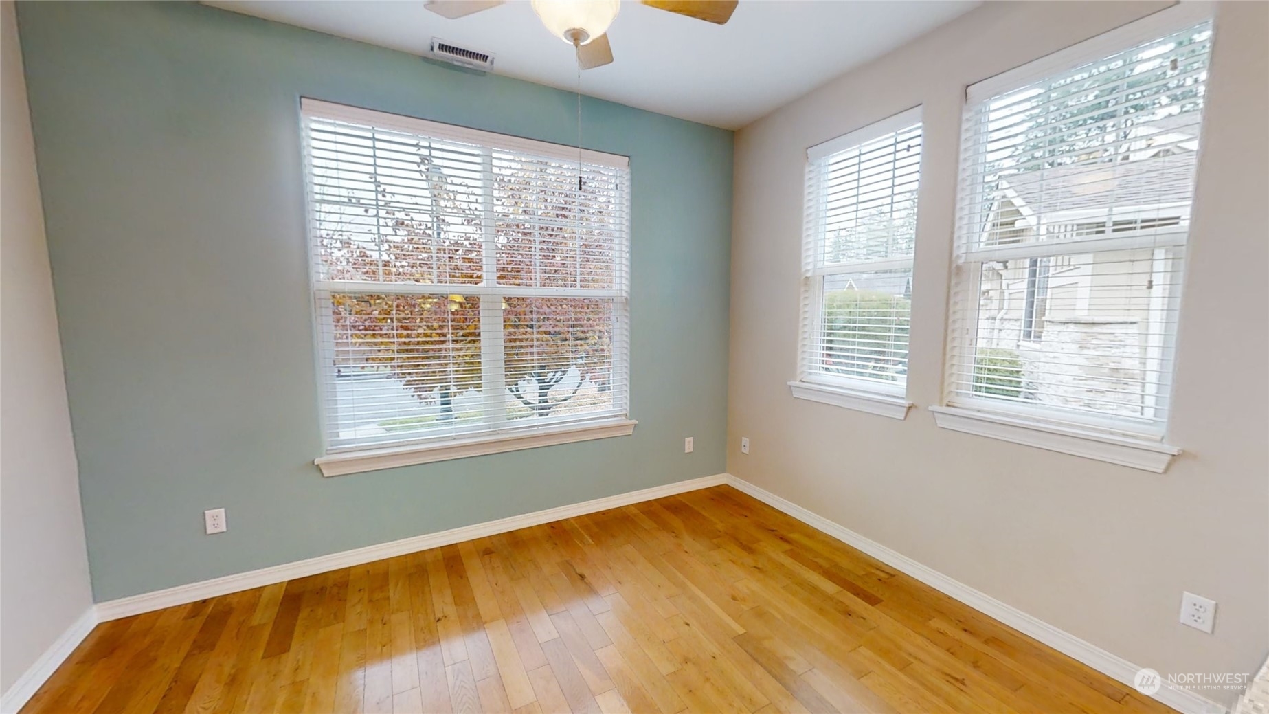 5018 Cypress Loop Northeast Lacey, WA 98516 - Photo 9 of 30 a view of empty room with wooden floor and fan
