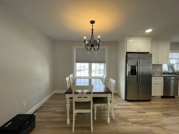 a kitchen with refrigerator and window