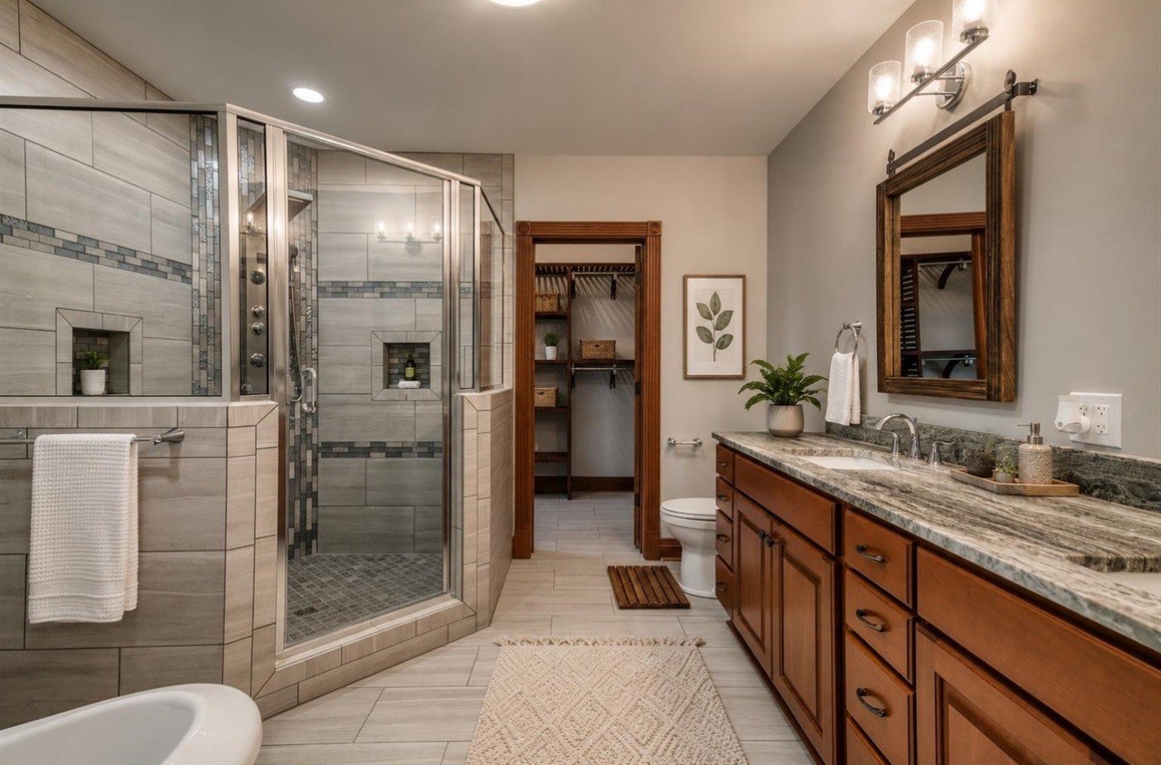 315 Blue And Gray Park Road Elkton, KY 42220 - Photo 63 of 66 a bathroom with a granite countertop sink mirror and shower