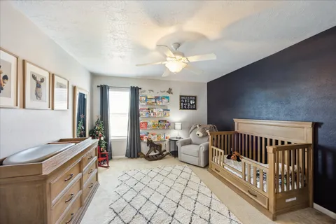 a bedroom with furniture and a window