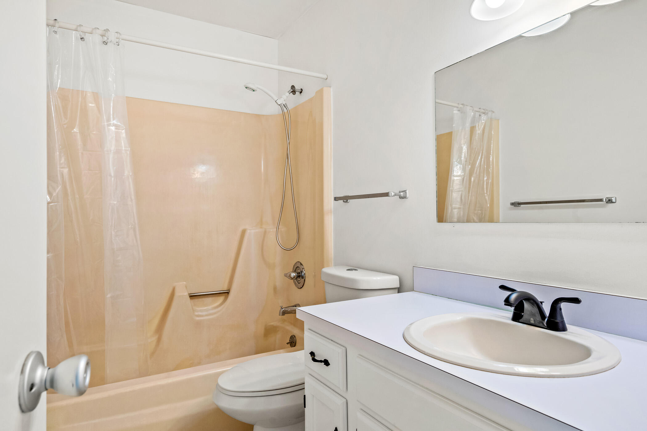 Undisclosed Address Vero Beach, FL 32962 - Photo 18 of 34 a bathroom with a sink a toilet and a mirror