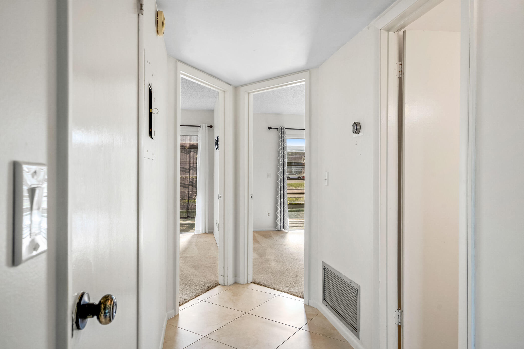 Undisclosed Address Vero Beach, FL 32962 - Photo 19 of 34 a view of a bathroom from a hallway