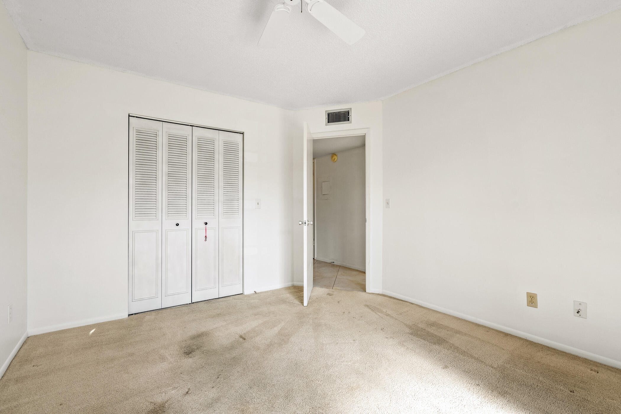 Undisclosed Address Vero Beach, FL 32962 - Photo 20 of 34 an empty room with windows and closet