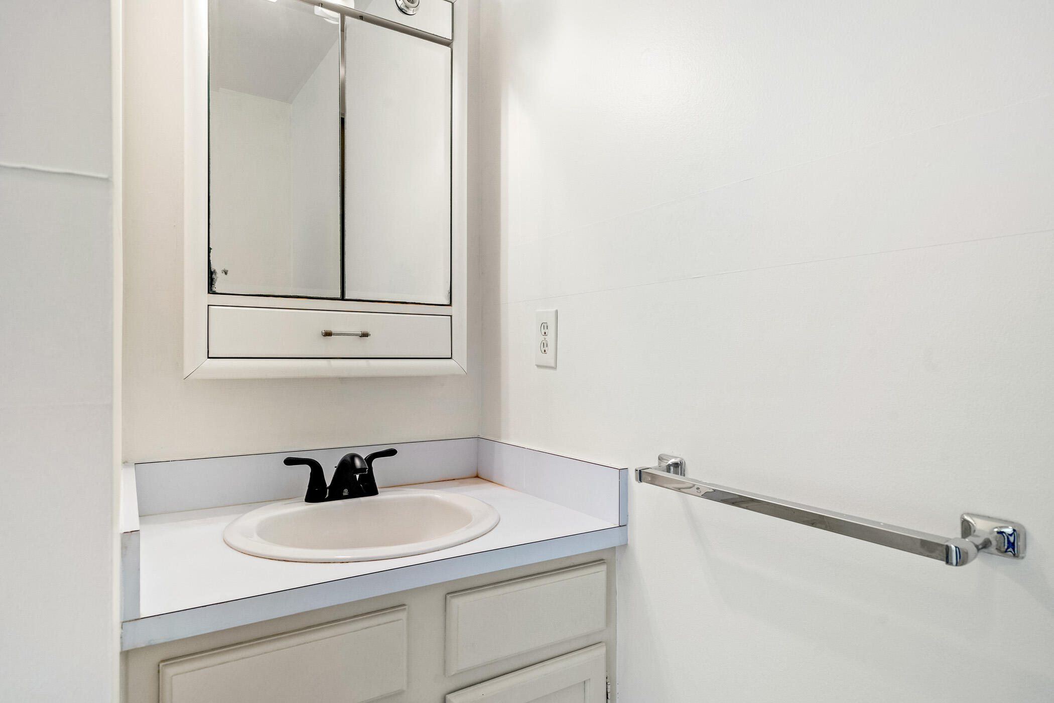Undisclosed Address Vero Beach, FL 32962 - Photo 23 of 34 a bathroom with a sink and a mirror