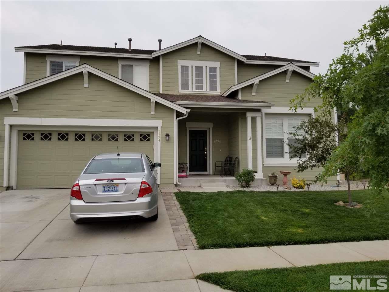8904 Wynne Street Reno, NV 89506 - Photo 1 of 7 a house view with a garden space