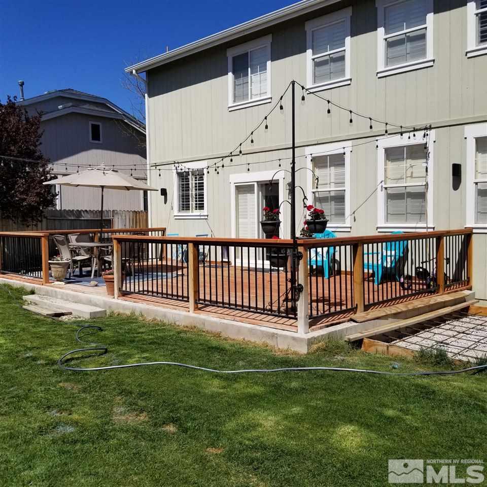 8904 Wynne Street Reno, NV 89506 - Photo 3 of 7 a view of a house with a yard and deck