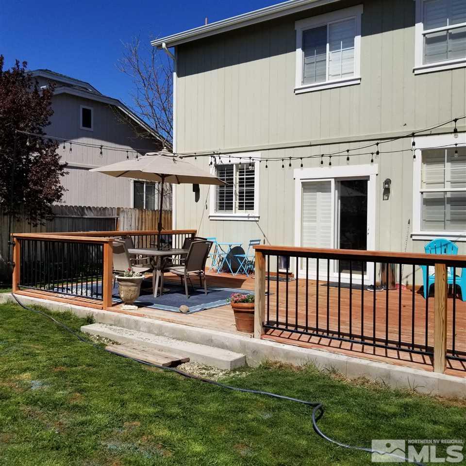 8904 Wynne Street Reno, NV 89506 - Photo 4 of 7 a view of a house with backyard porch and sitting area