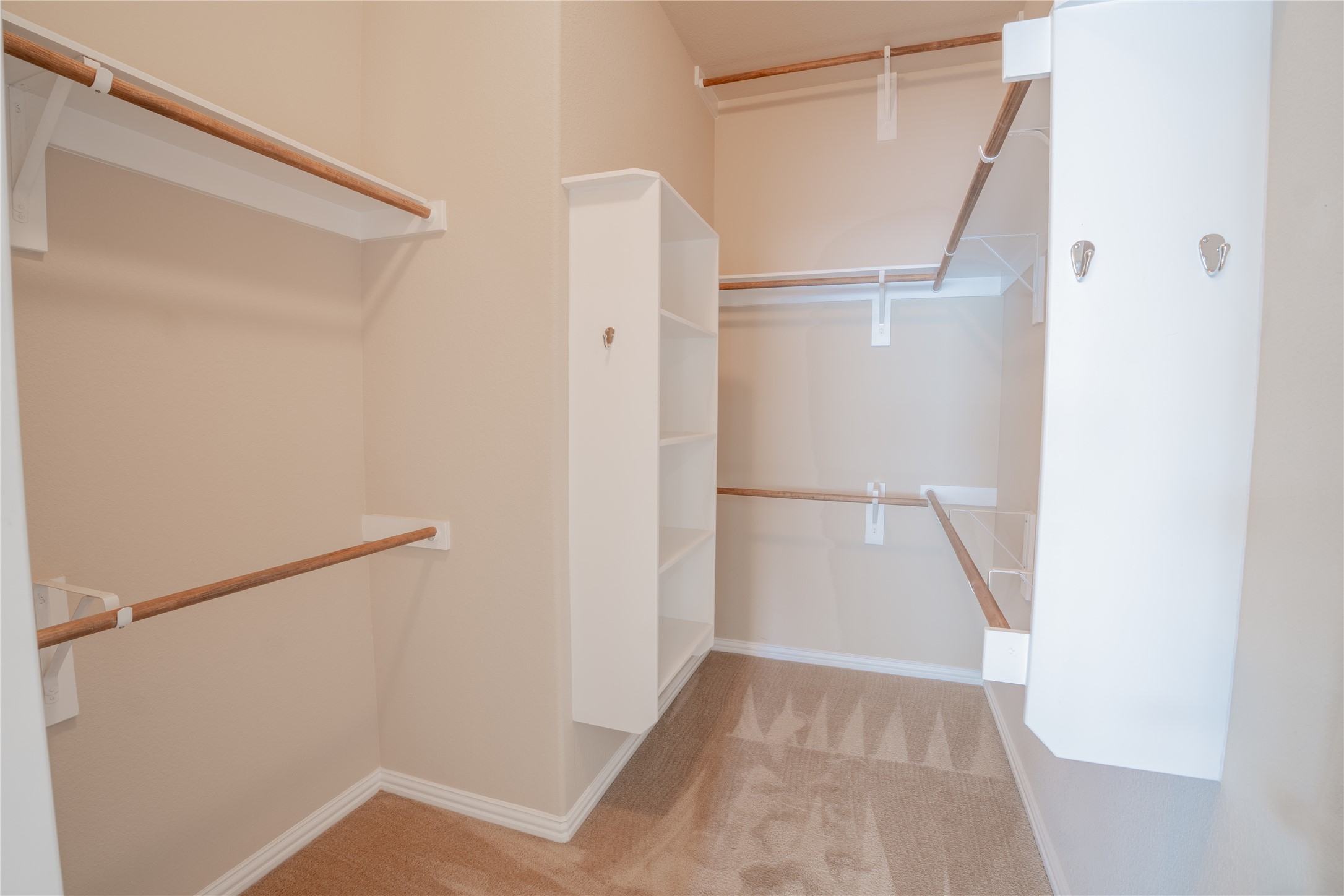 403 Tascate Street Georgetown, TX 78628 - Photo 13 of 26 Ample closet space with built-in shelving and hanging rods for organized storage.
