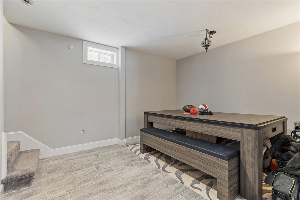 103 Reed Street Rockland, MA 02370 - Photo 29 of 33 a room with toys and wooden floor