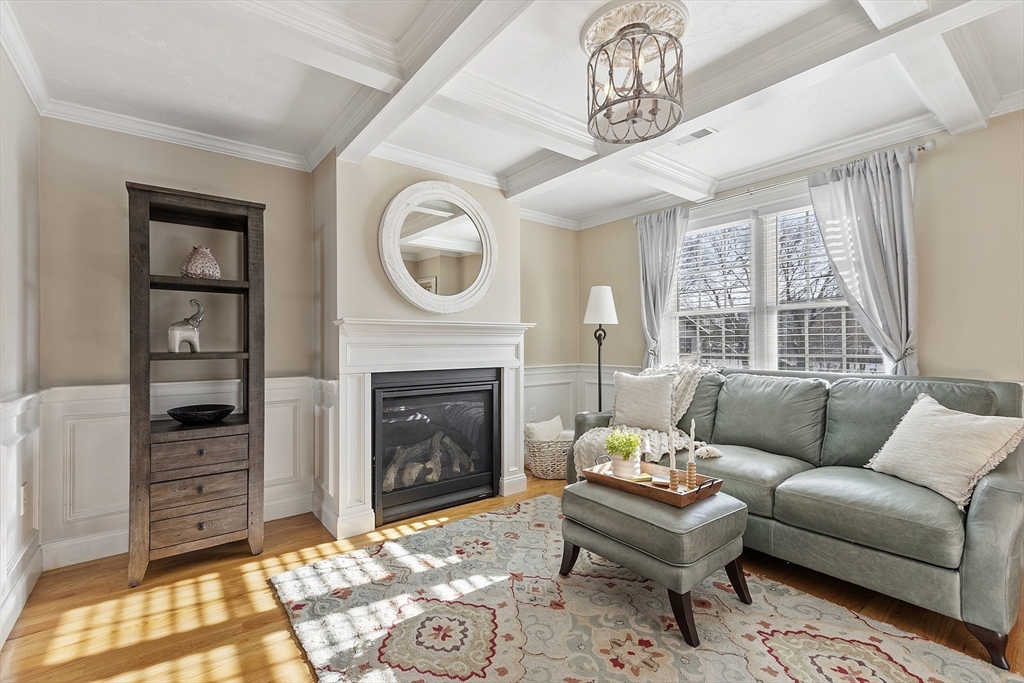 103 Reed Street Rockland, MA 02370 - Photo 4 of 33 a living room with furniture a fireplace and a window