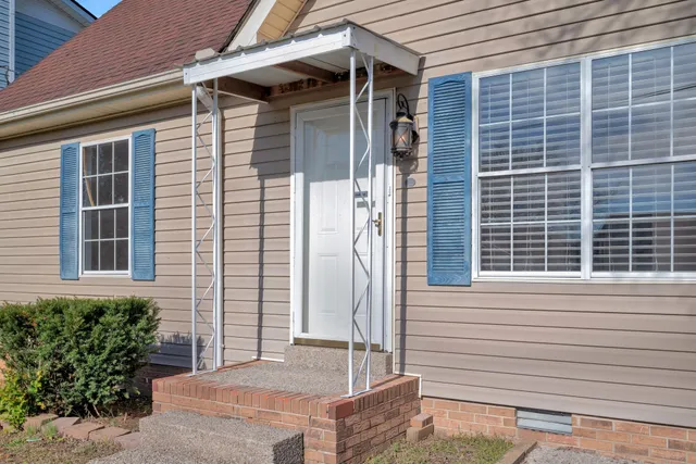 a front view of a house with a garage