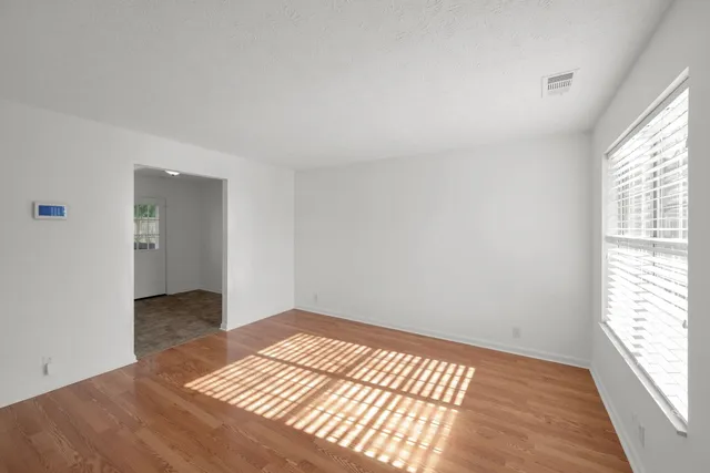 a view of an empty room and window