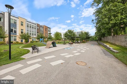 a view of a street with a slide and a table