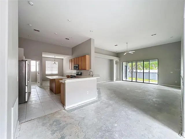 a kitchen with a stove top oven sink and cabinets