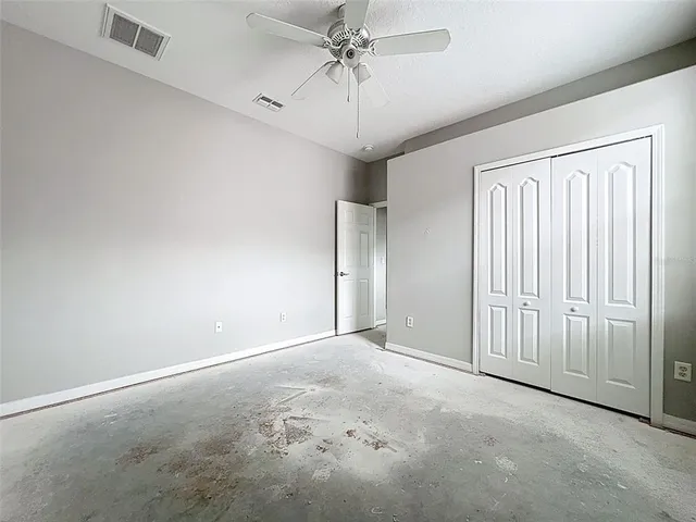 a view of a livingroom with wooden floor and a window
