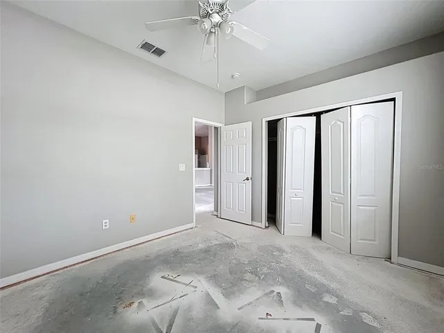 a bathroom with a granite countertop sink mirror bathtub and toilet