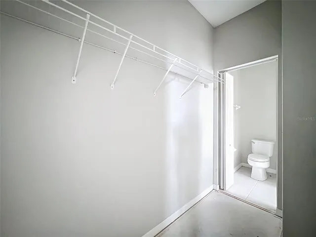 a kitchen with stainless steel appliances a refrigerator sink and cabinets