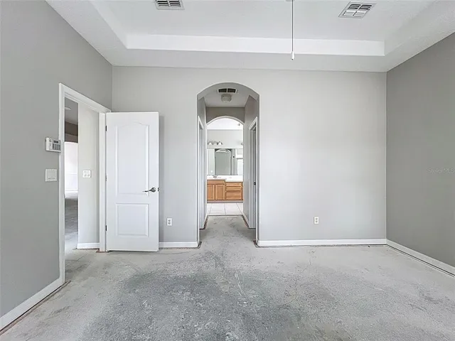 a front view of house with yard and trees