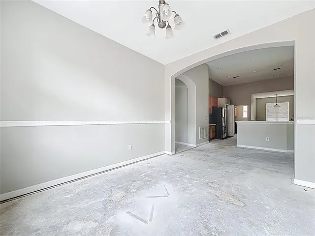 a view of a kitchen with a sink and a ceiling fan
