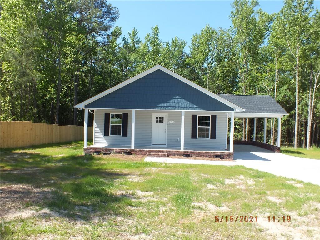 2302 Douglas Road Lancaster, SC 29720 - Photo 1 of 17 a front view of a house with a yard
