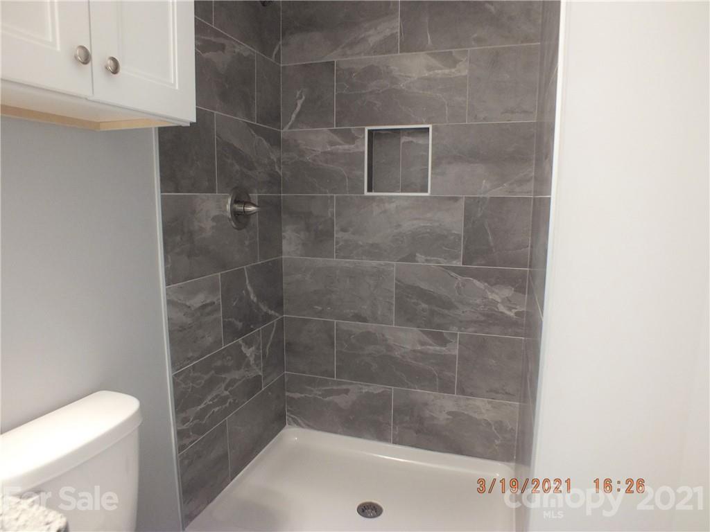 2302 Douglas Road Lancaster, SC 29720 - Photo 13 of 17 a bathroom with a shower and toilet