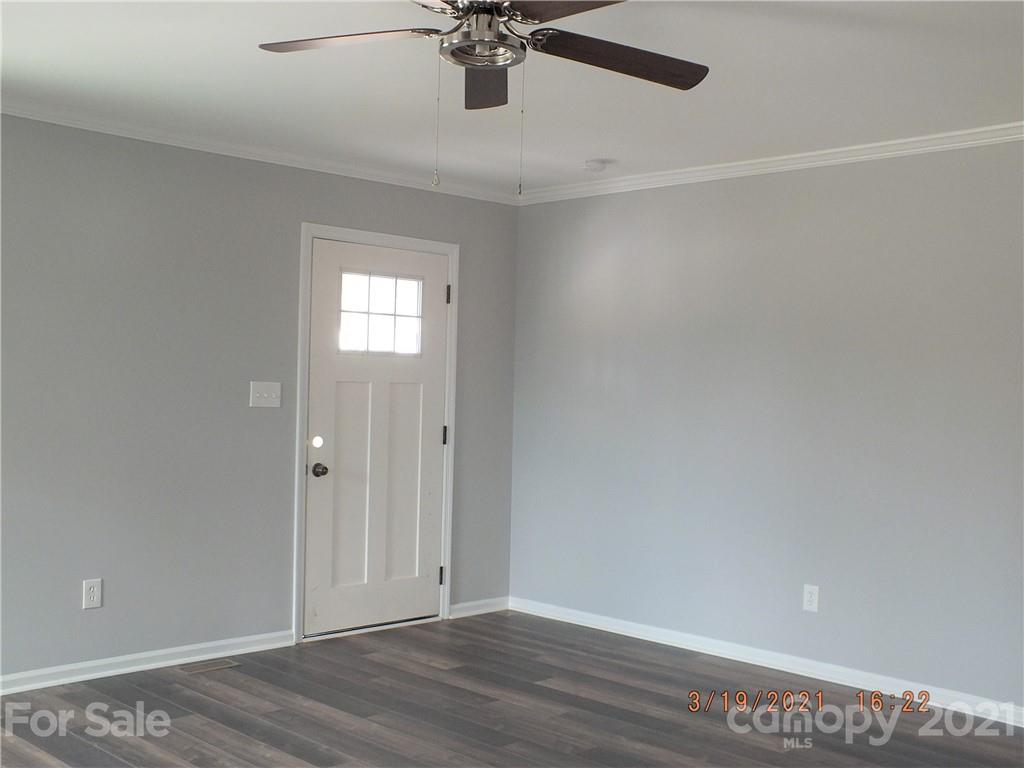 2302 Douglas Road Lancaster, SC 29720 - Photo 6 of 17 a view of a room with wooden floor and ceiling fan