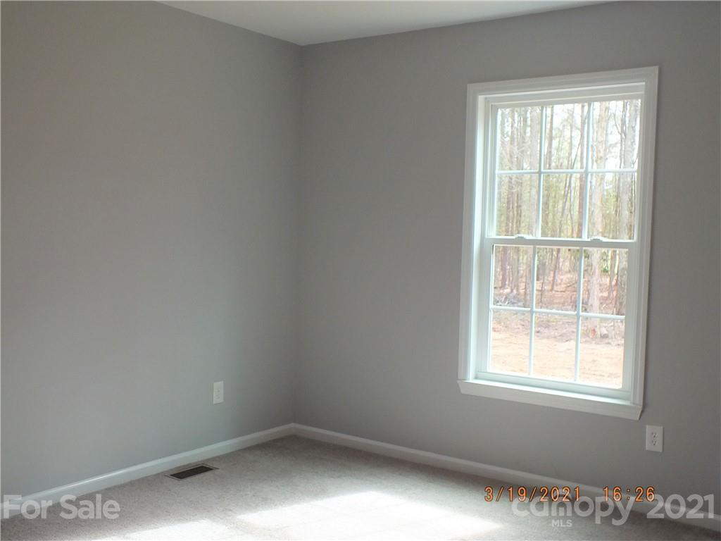2302 Douglas Road Lancaster, SC 29720 - Photo 10 of 17 an empty room with a window
