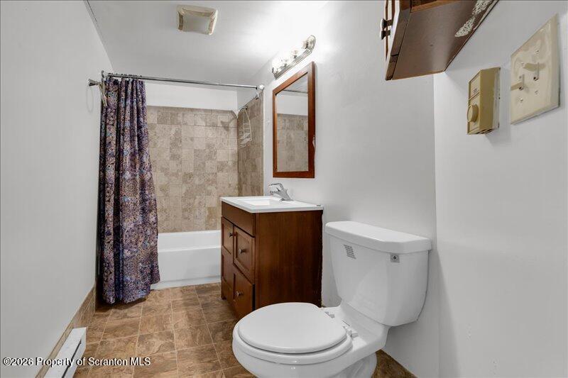 1228 Lake Road Factoryville, PA 18419 - Photo 16 of 43 a bathroom with a toilet sink vanity and mirror