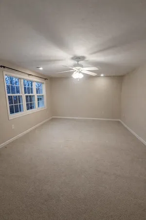 a view of empty room with windows