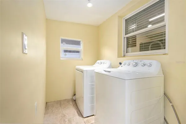 a bathroom with a sink and a window