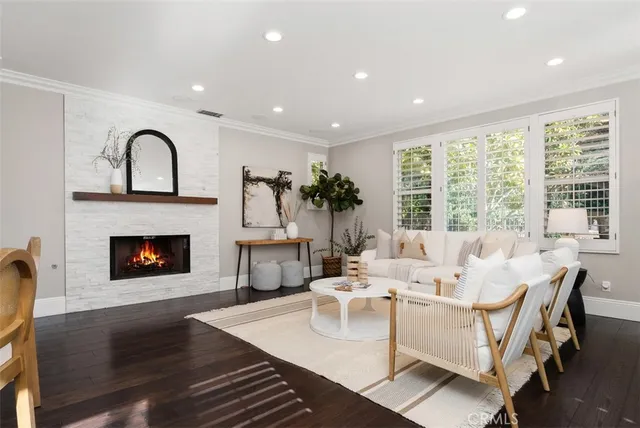 a spacious bathroom with a tub a sink and a large mirror